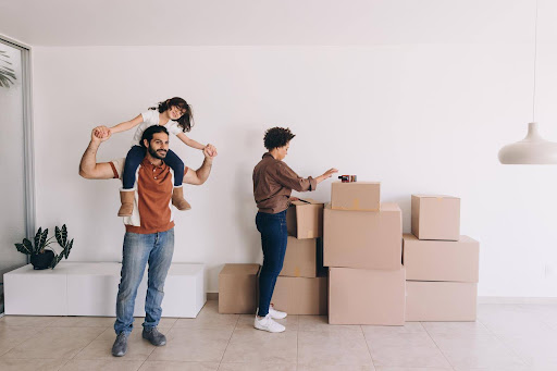 A family moving into their new home in the U.S., representing the start of a new chapter and the opportunity to launch a resilient business that supports their future.