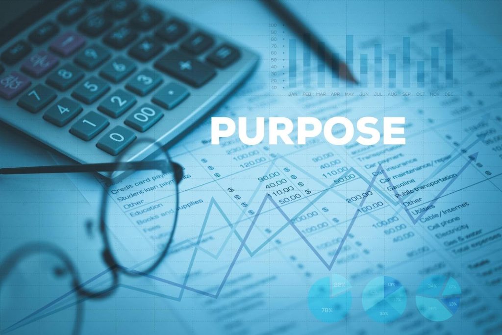 Financial documents, calculator, and glasses with the word “PURPOSE” highlighted, symbolizing how purpose-driven businesses shape the future of franchise growth.