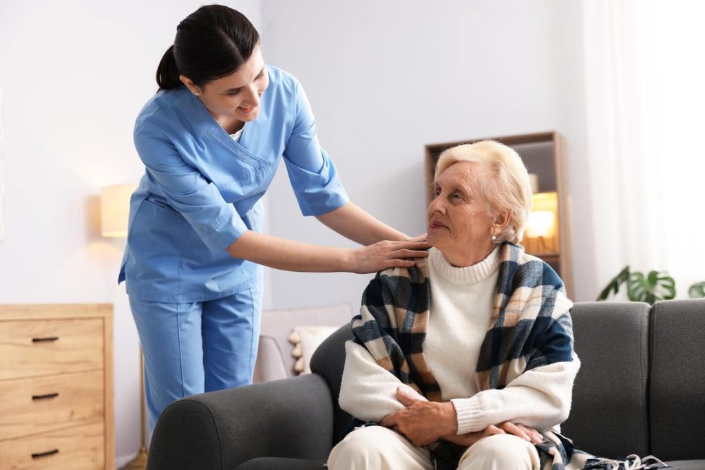 Ace Home Care Franchise caregiver supporting an older adult at home, highlighting personalized care that sets it apart from other healthcare franchises.