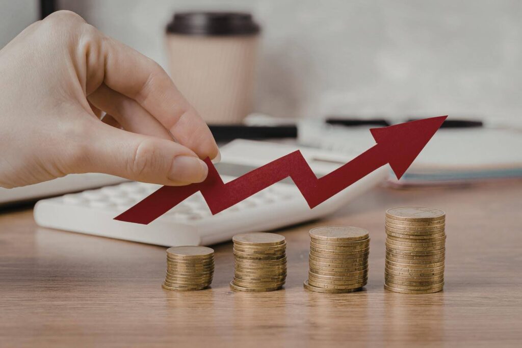 Rising red arrow above stacked coins symbolizing business Growth and profitability with Ace Home Care Franchise, highlighting faster break-even timelines in the home care industry.