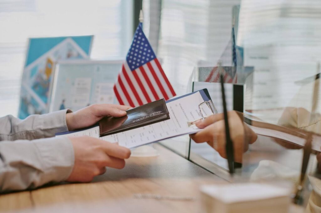 E-2 Visa application process at an immigration office, illustrating why Ace Home Care Franchise is a popular Visa investment option for international entrepreneurs.