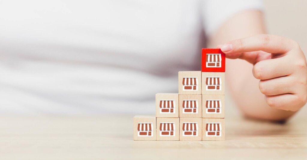 Franchise system growth illustrated by stacked business icons showing scalable success with Ace Home Care Franchise