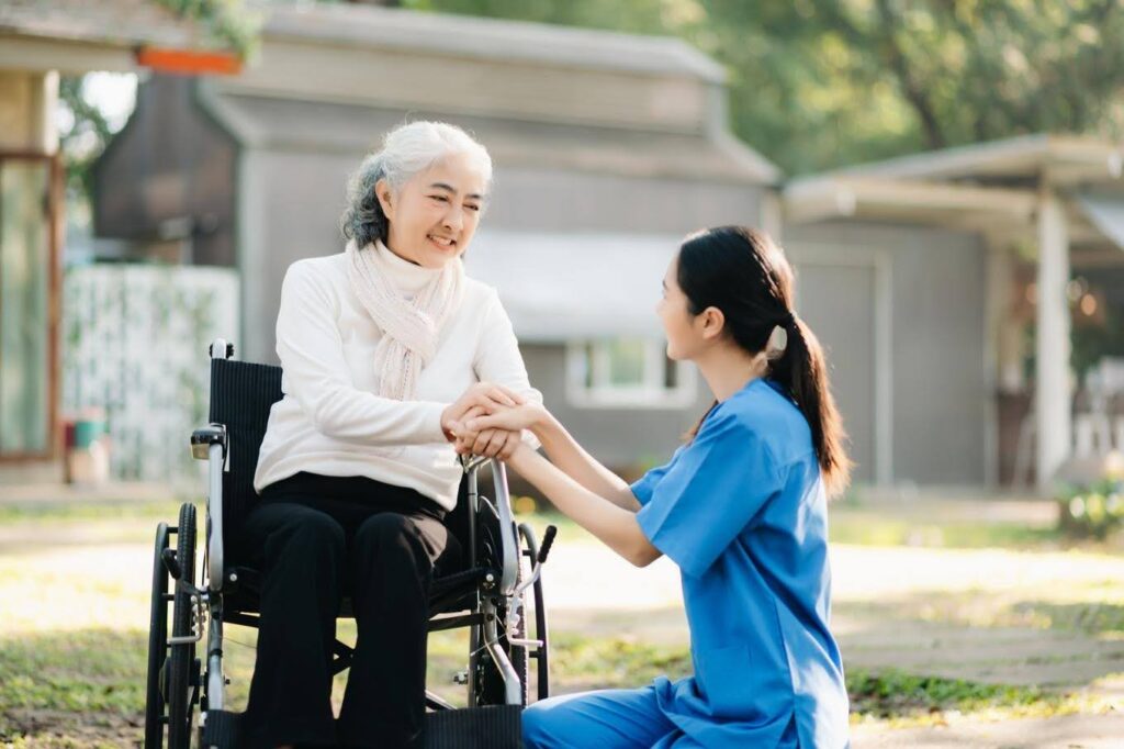 Caregiver supporting a senior in a wheelchair as Ace Home Care Franchise highlights why senior care businesses keep growing every year