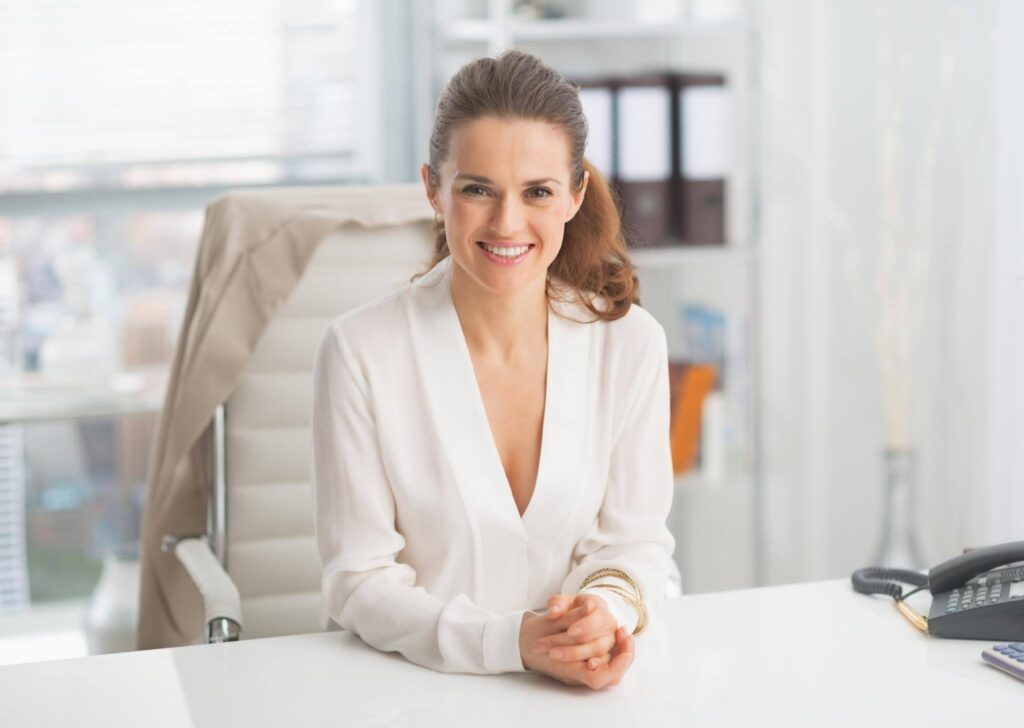 Successful Ace Home Care Franchise owner demonstrating leadership, business growth, and operational excellence in a professional office setting