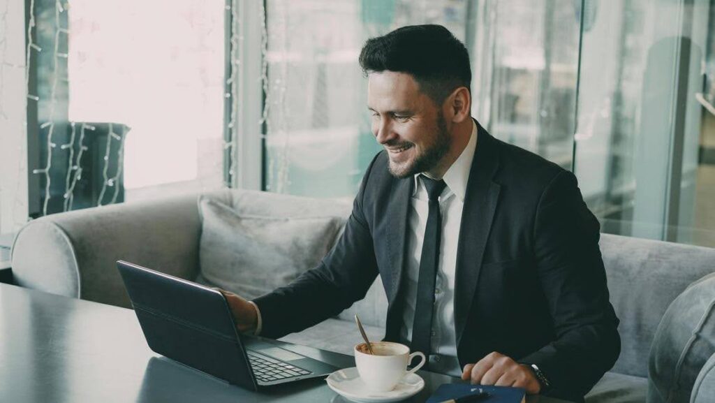 Business owner working on a laptop to attract their first clients with Ace Home Care Franchise, building a successful home care franchise through proven marketing and support.