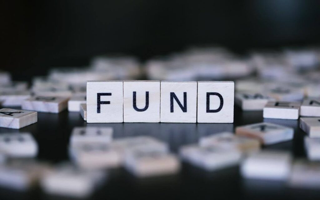 Emergency fund concept with letter blocks spelling 'FUND,' illustrating the financial preparation needed before investing in an Ace Home Care Franchise and starting a successful home care business.