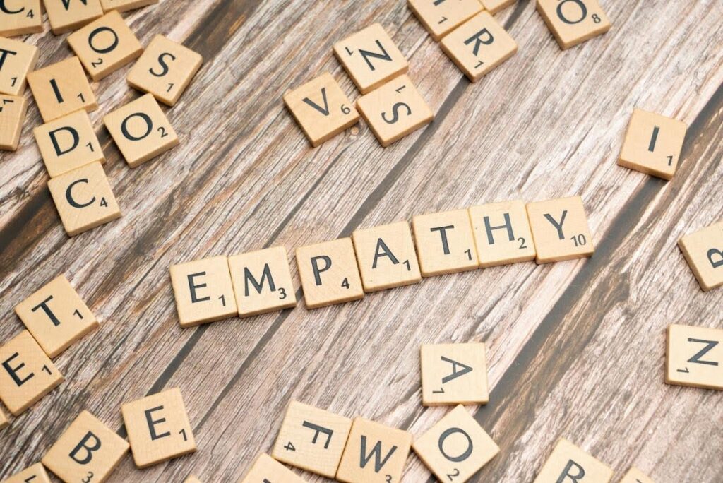 Empathy displayed through letter tiles, representing how Ace Home Care Franchise helps owners build compassionate and successful home care businesses
