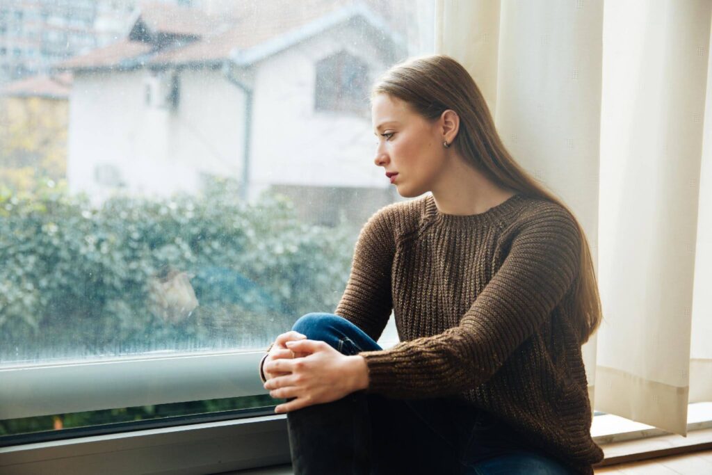 Prospective entrepreneur reflecting on the fears of starting a business, representing how Ace Home Care Franchise helps new franchisees overcome common fears with training, guidance, and ongoing support.