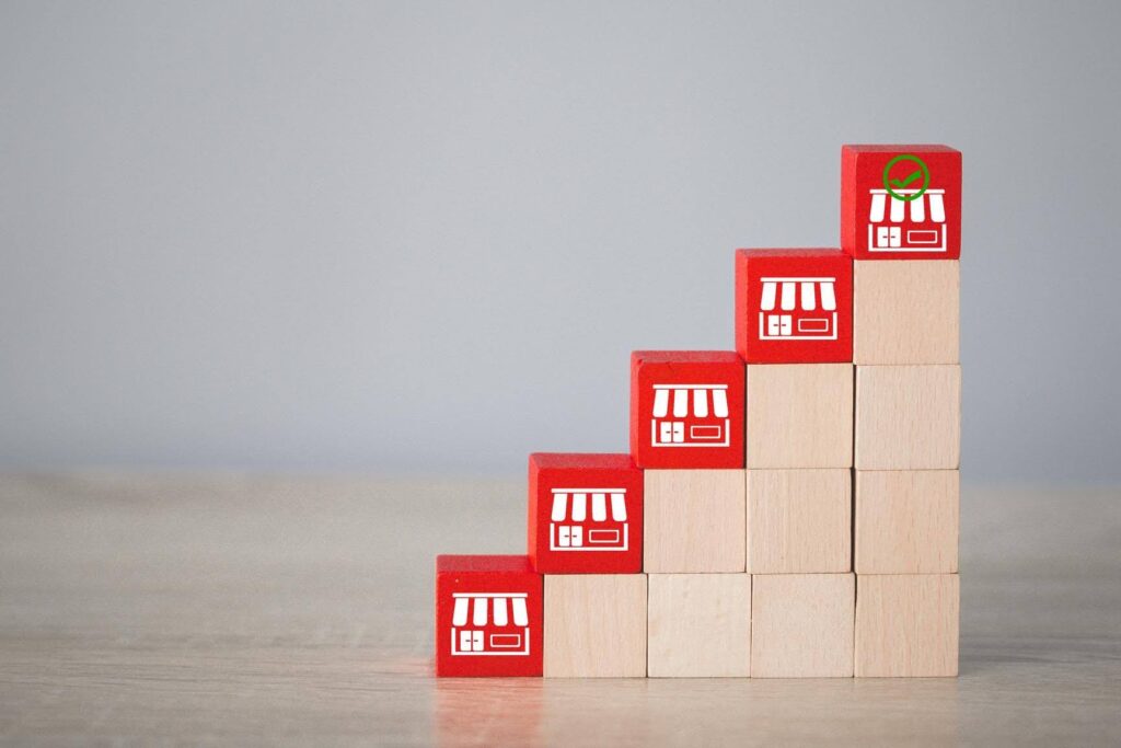 Stacked franchise blocks representing the choice between starting an independent business or joining Ace Home Care Franchise for proven support and growth