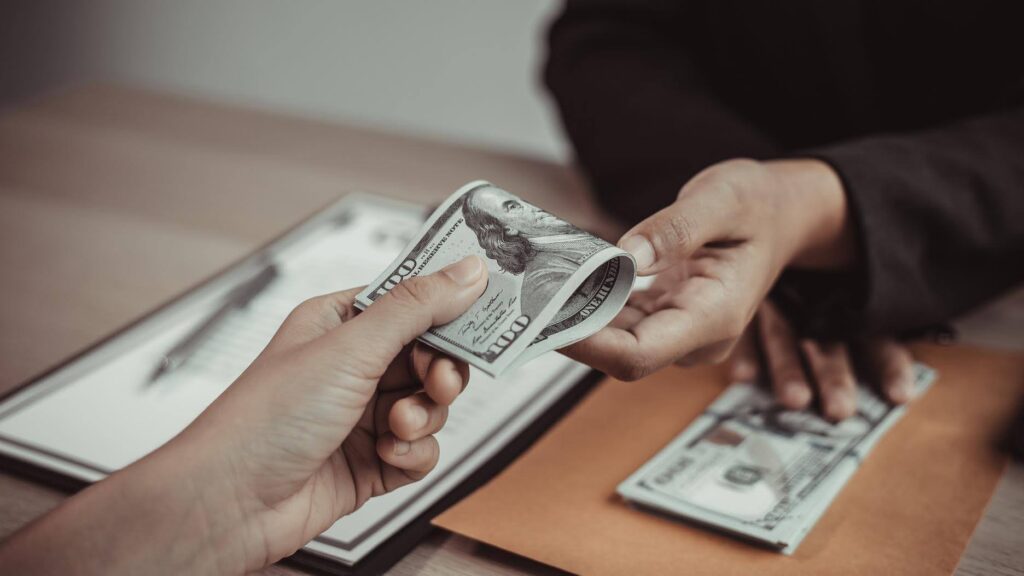 Business owner reviewing franchise fees and investment costs, illustrating how Ace Home Care Franchise provides value, training, and support through its franchise fee structure.